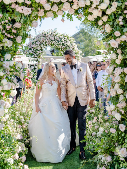 A bride and groom walking down the aisle