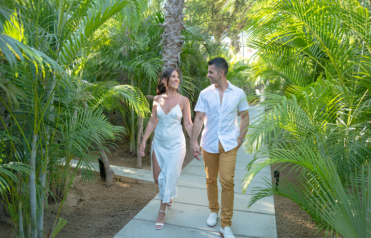 A married couple holding hands