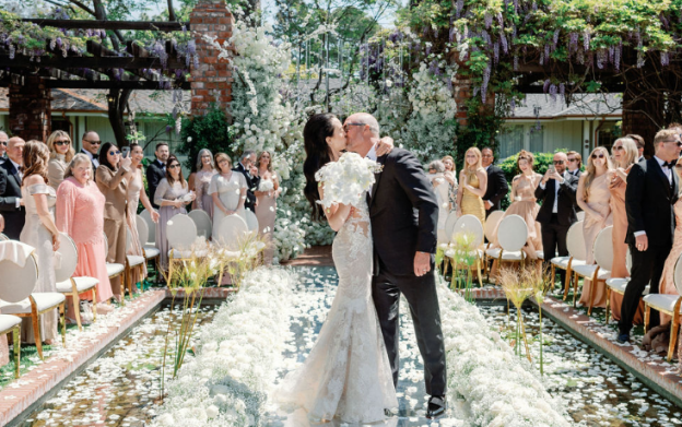 A couple kissing at their wedding