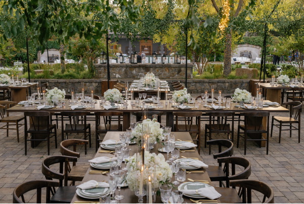 Set dining tables for a dinner at a destination wedding