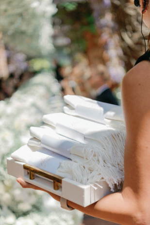 A set of engraved towels for guests at a destination wedding
