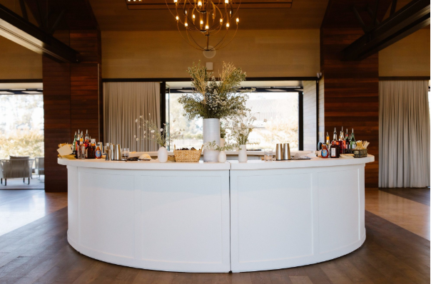 Modern bar setup with curated cocktails, elevating private luxury dinners.