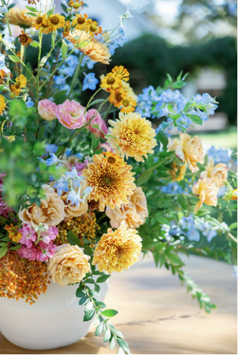 A carefully curated flower pot by luxury wedding concierges.