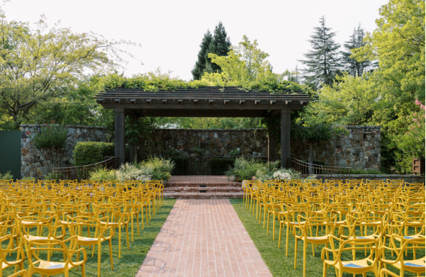A luxury wedding altar set up for the ceremony in a garden.