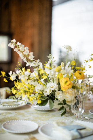 A floral arrangement of yellow and white blooms