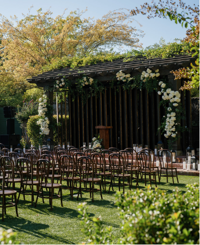 An outdoor luxury wedding altar shown before sunset.