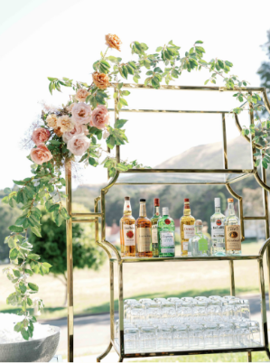 A modern bar design accented with fresh blooms and gold detailing.