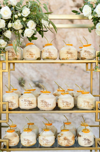 A stand for drinks is set up at Katie and Taylor’s luxury destination wedding.