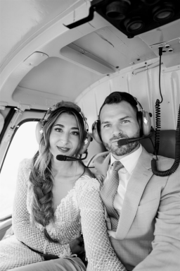 A couple in a helicopter on their wedding day