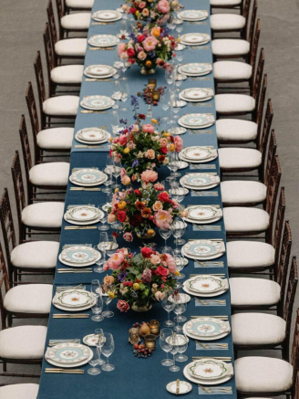 A table setting with vibrant floral arrangements