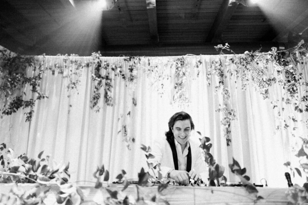 A wedding DJ setting the tone for a stylish evening reception