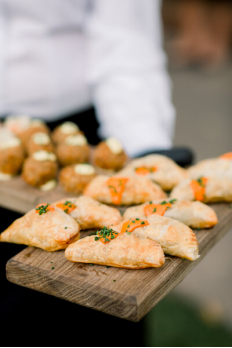 A person serving hors d’oeuvres at a wedding