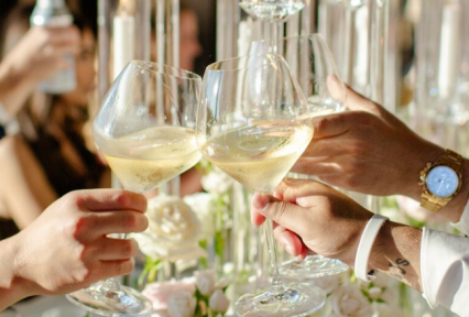 Anonymous people clinking glasses together