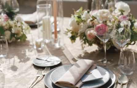 Wedding cutlery set beside roses