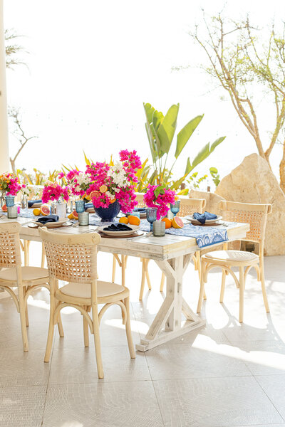 a table with floral centerpieces.