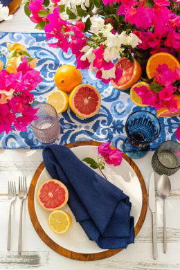 Tropical flowers adorning a wedding table with vibrant Caribbean-inspired decor.