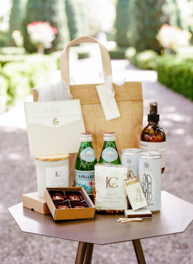 Curated wedding weekend welcome gift box with drinks, snacks, and custom details