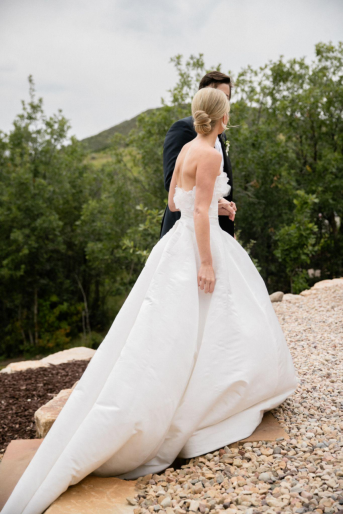 A bride and groom walking hand in hand