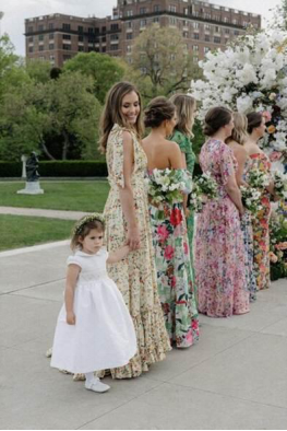 Bridesmaids wearing floral dresses at a wedding