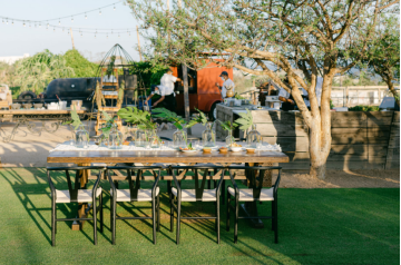 Table setup for a rehearsal dinner.
