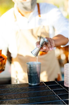 A man mixing up drinks.