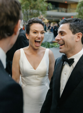 A happy couple at their wedding.