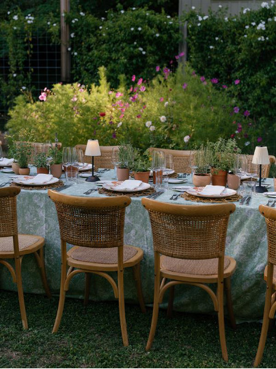 A beautifully set table with a bouquet.