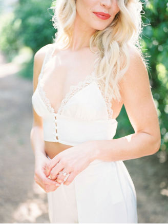 a bride in a white outfit.