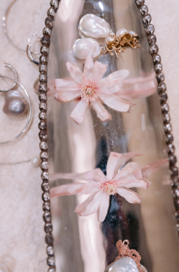 Still life of bridal accessories, including pearls and floral elements