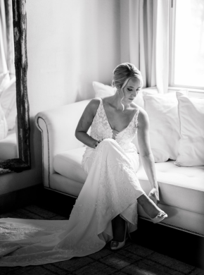 a bride sitting on the couch.