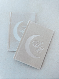 An image of two polished vow books prepared for a wedding ceremony in Houston