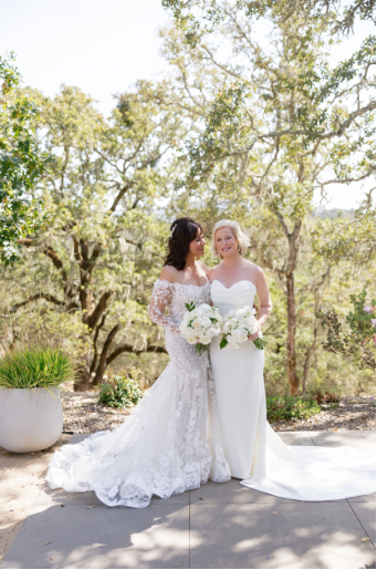 happy brides standing outdoors