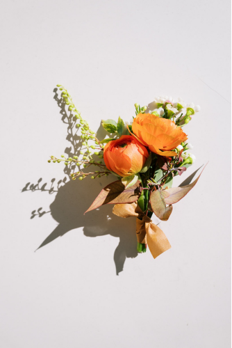 a wedding bouquet with orange flowers
