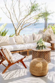 An image of a white deck against the sea  