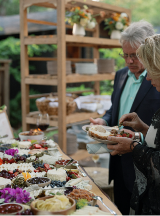 Guests enjoying the experience at a curated food station