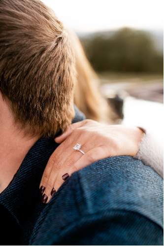 a bride-to-be showing off her engagement ring