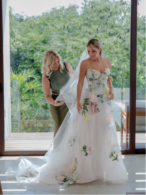 a bride getting ready by the glass window
