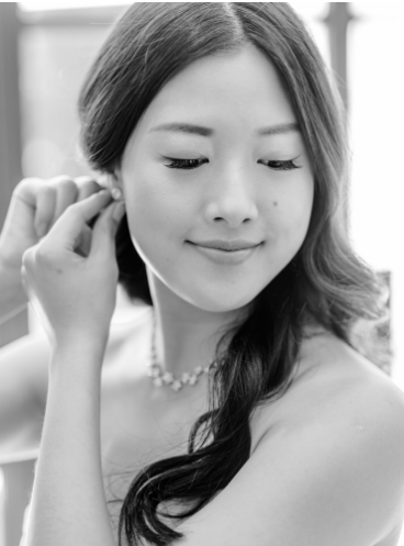 A B&W picture of a bride getting read