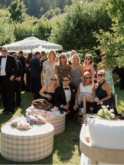 A group of guests looking relaxed at a wedding