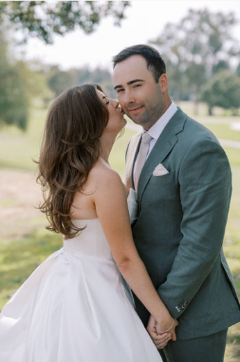 A bride kissing her groom